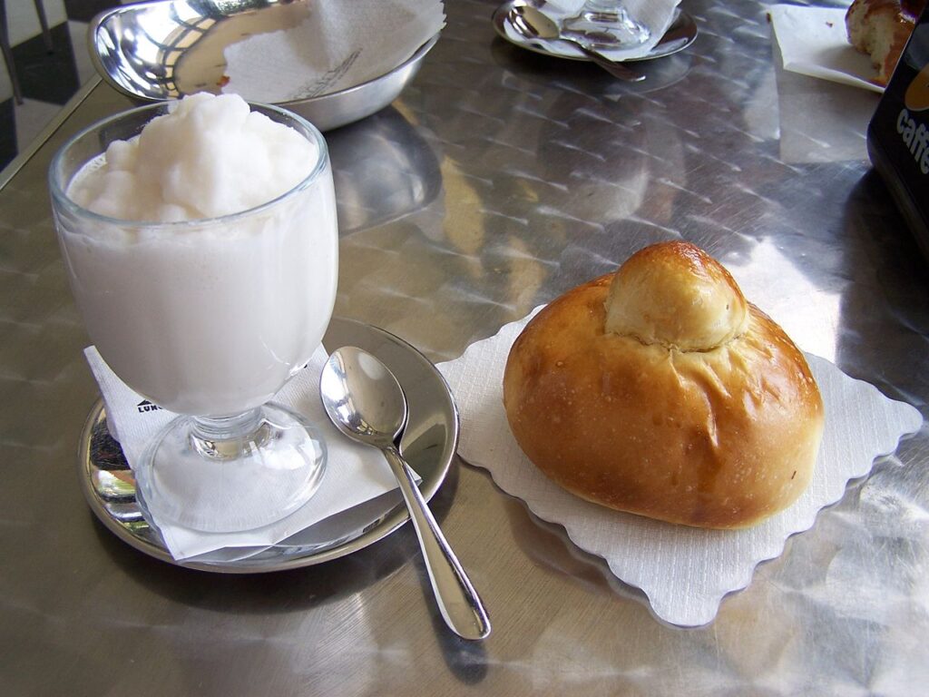 Typical Sicilian dishes and products: Lemon granita with brioche